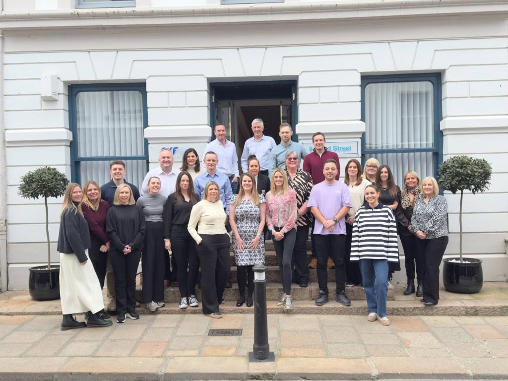 PKF Channel Islands team standing outside Bond Street Office